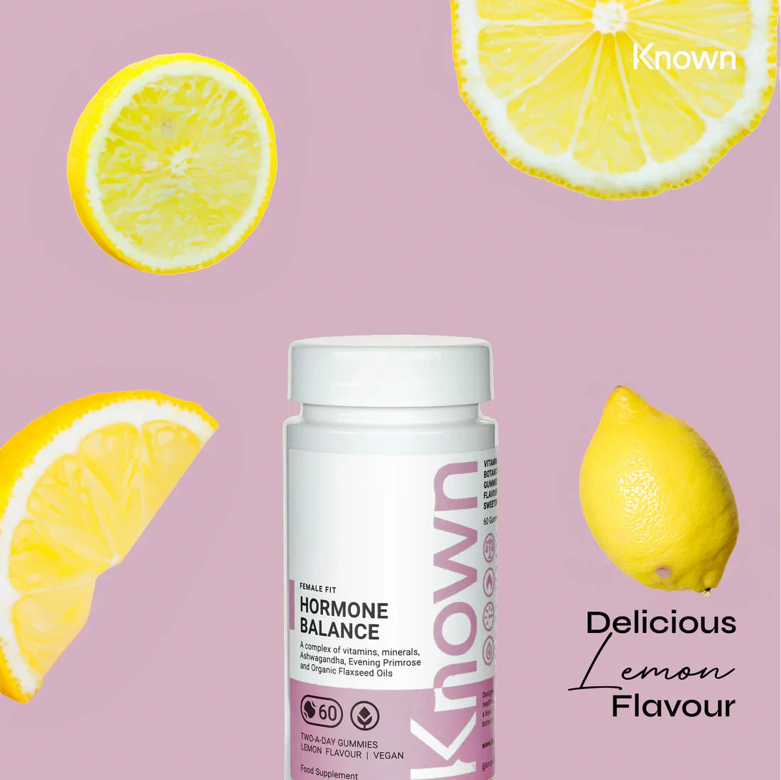"Known Hormone Balance Gummies VEGAN bottle surrounded by fresh lemon slices, emphasizing the delicious natural lemon flavor."2