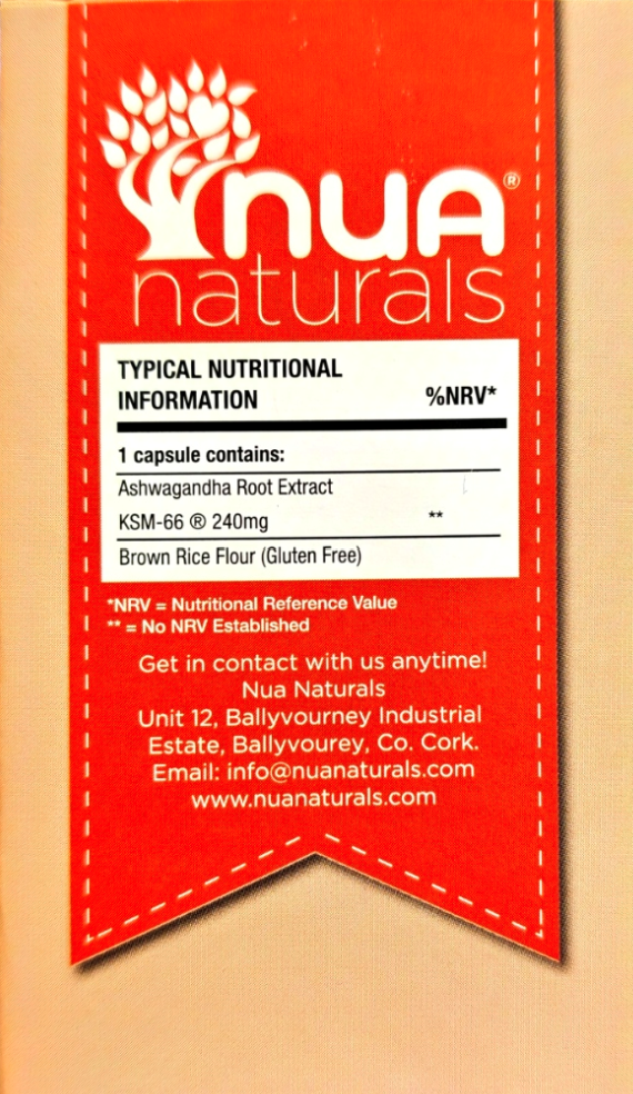 A red NUA naturals label or packaging insert with a white nutrition information panel, photographed against a beige background.