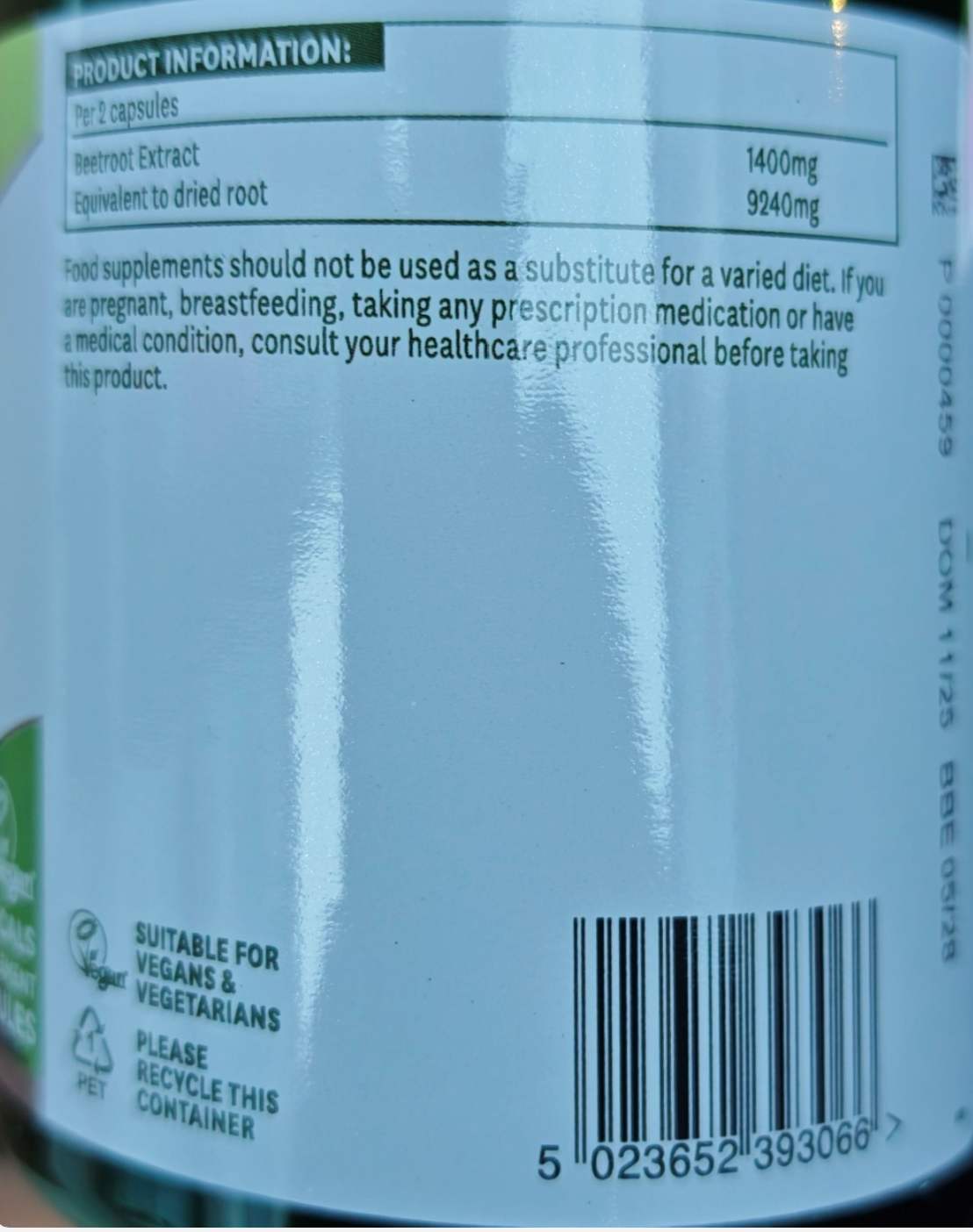 Close-up of a product label with text and a barcode on a white background