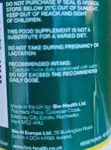 Close-up of a green product label with text