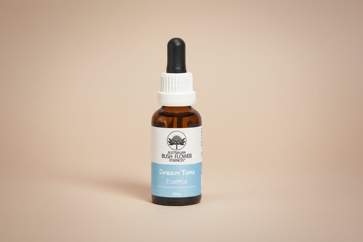 Bottle of 'Dream Time' Essence with a white cap on a white background