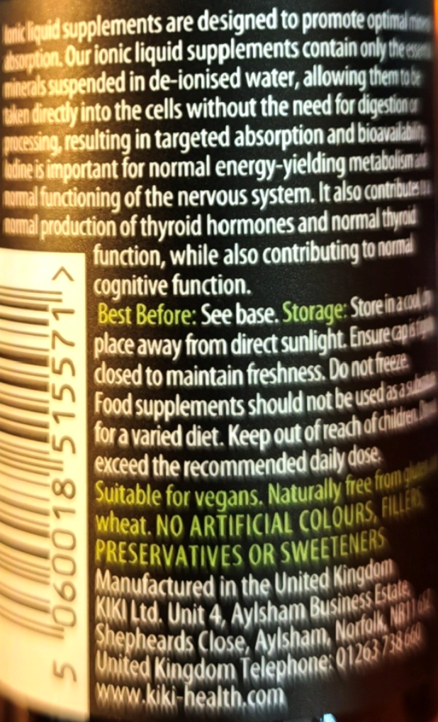 Close-up of a supplement bottle label showing product information, including a barcode on the left, English text, and Kiki Health branding and website.