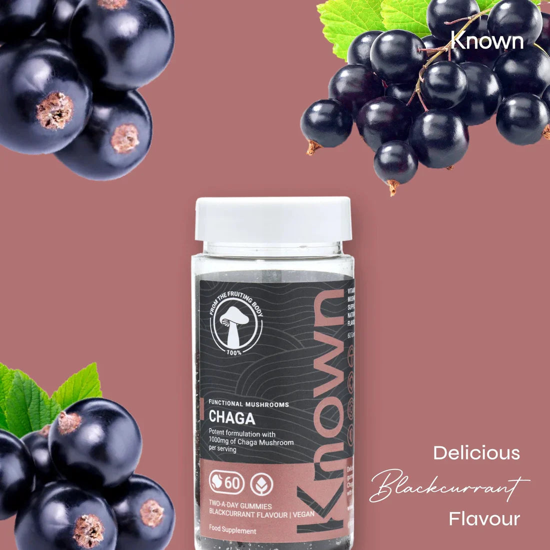"Known Chaga Gummies VEGAN bottle surrounded by fresh blackcurrants, emphasizing the delicious natural flavor."