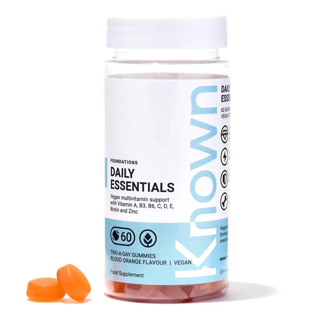 "Front view of Known Daily Multivitamin Gummies VEGAN, 60-count bottle with a couple of gummies around it."