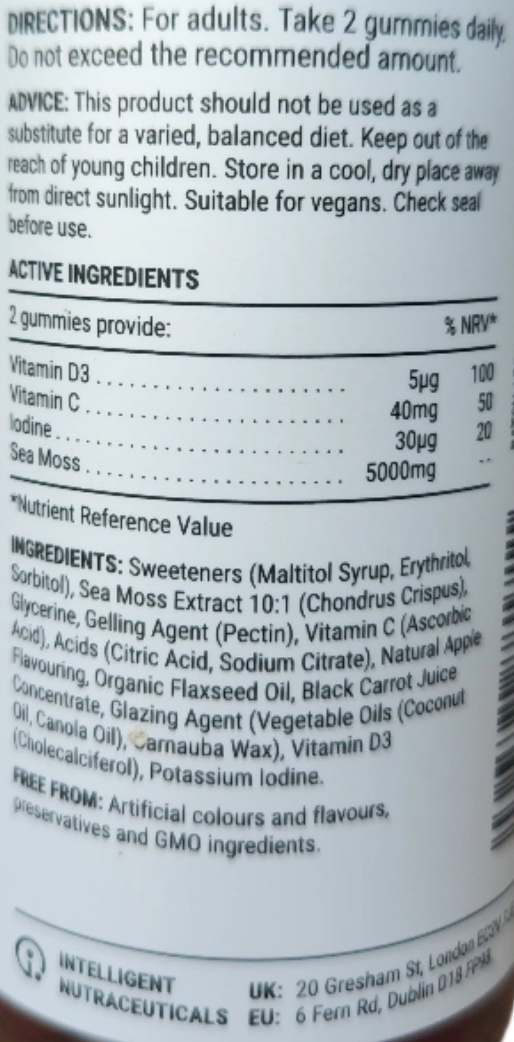 Front view of Known Sea Moss Gummies VEGAN, 60-count bottle with a couple of gummies around it-7