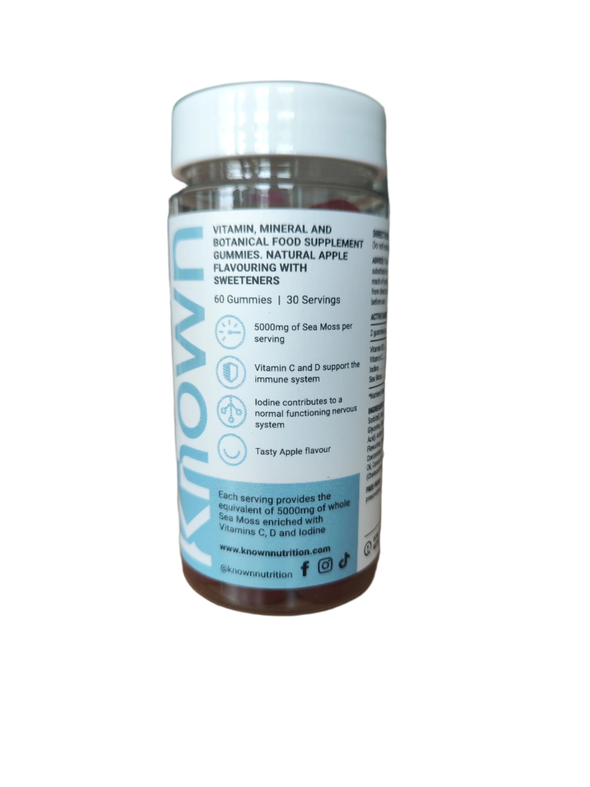 Front view of Known Sea Moss Gummies VEGAN, 60-count bottle with a couple of gummies around it-6