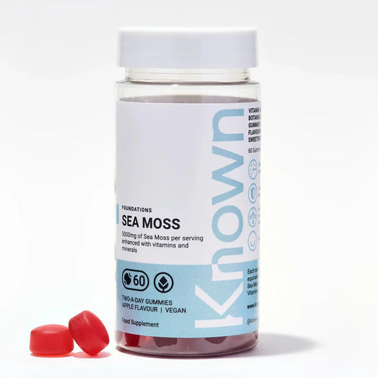 Front view of Known Sea Moss Gummies VEGAN, 60-count bottle with a couple of gummies around it.