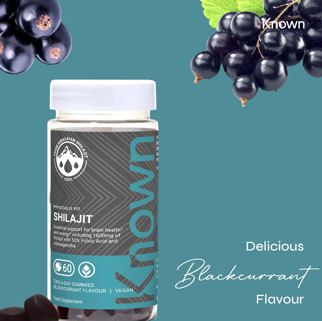 "Known Shilajit Gummies VEGAN bottle surrounded by fresh blackcurrants, emphasizing the delicious natural flavor."