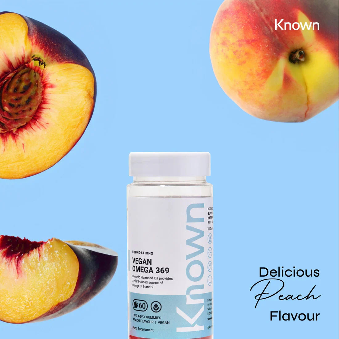 "Known Vegan Omega 369 Gummies VEGAN bottle surrounded by fresh peaches, emphasizing the delicious natural flavor."