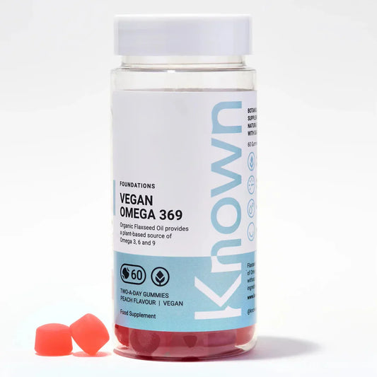 "Front view of Known Vegan Omega 369 Gummies VEGAN, 60-count bottle with a couple of gummies around it."