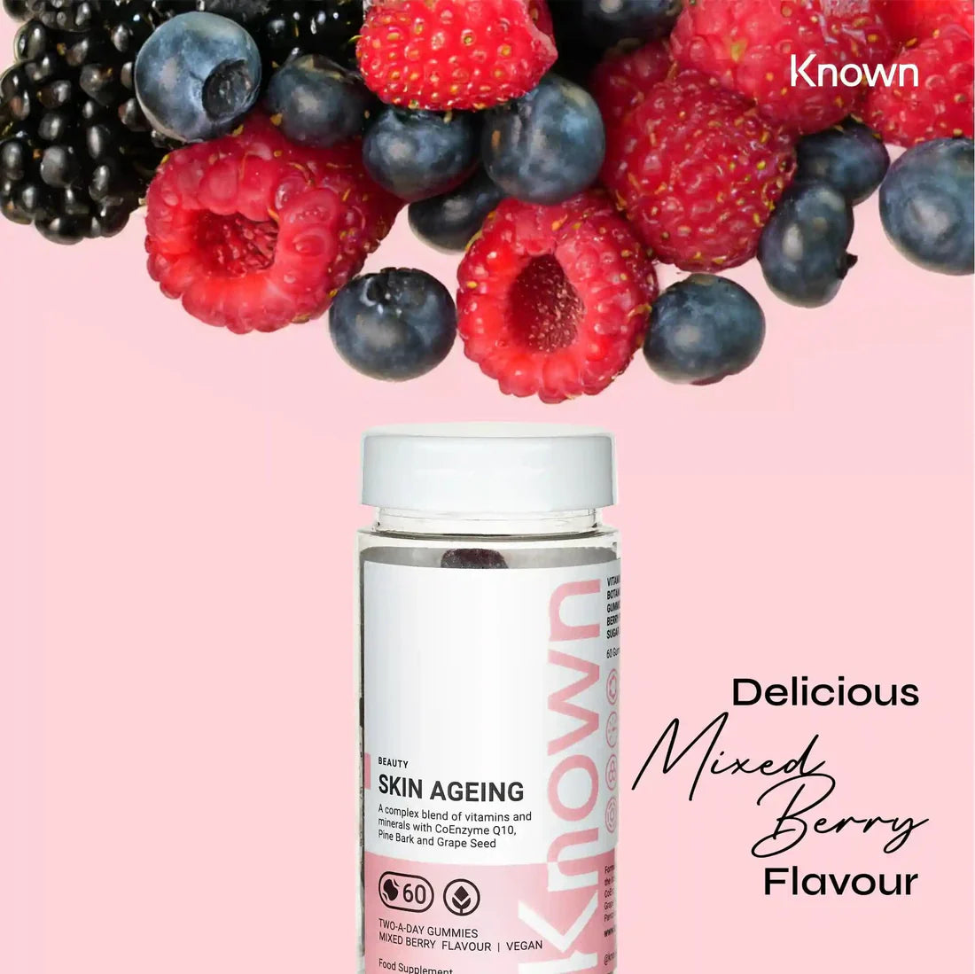 "Known Skin Gummies VEGAN bottle surrounded by mixed berries, emphasizing the delicious natural flavour."