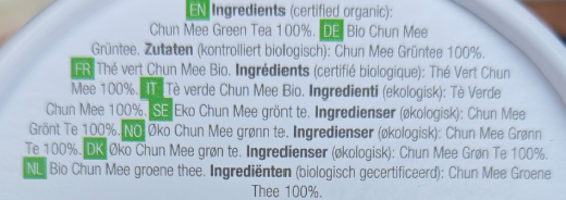 Product label with text in multiple languages on a white background