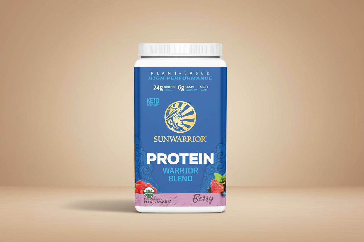 A container of Sunwarrior Warrior Blend Berry Protein powder with the label showing the brand logo, a berry image, and product details such as '24g protein', '6g fiber', and 'MCTs'.