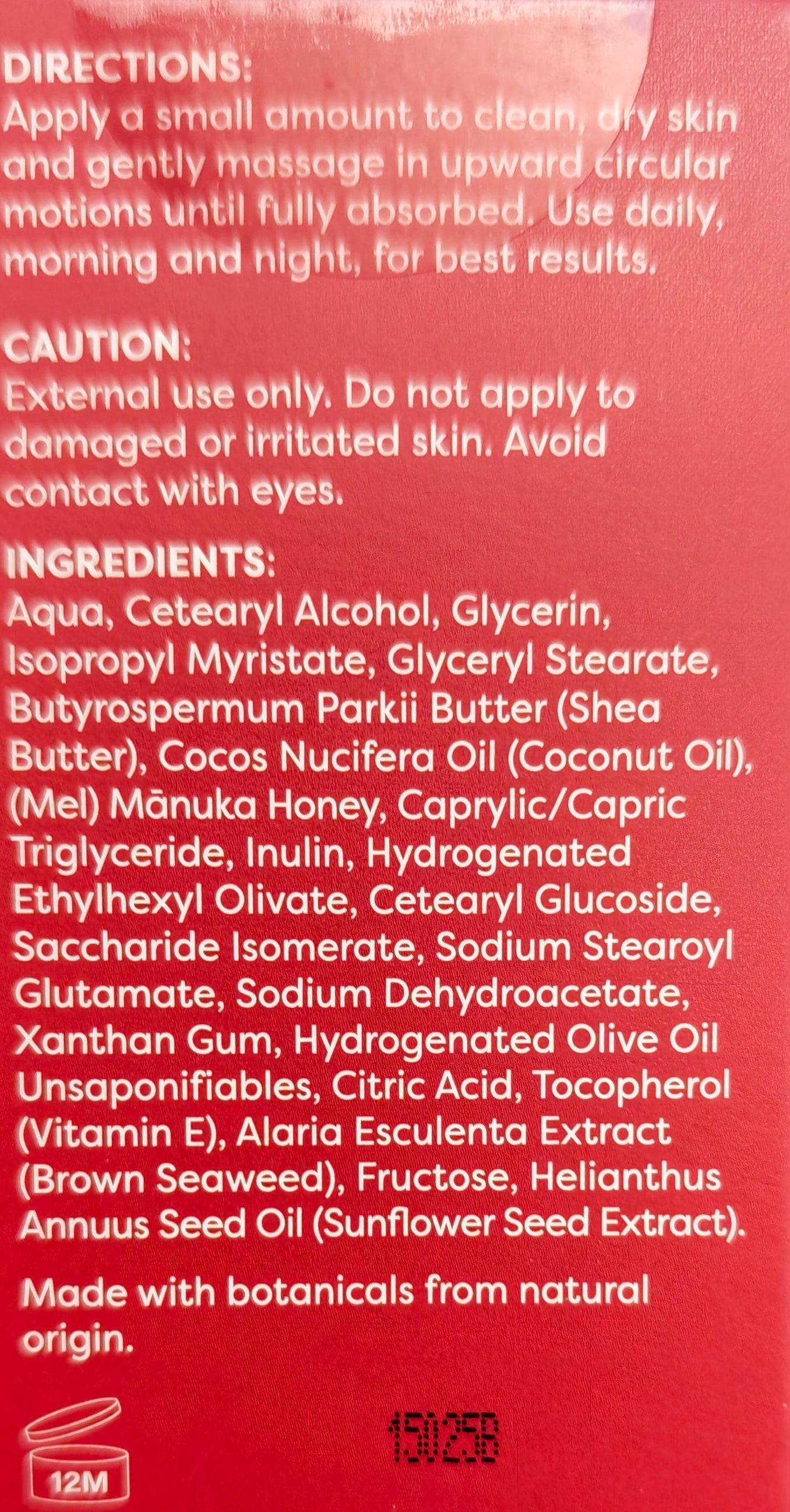 Red box with white label and barcode on a dark surface