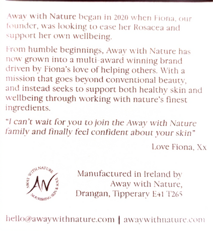 A close-up of a white card or label with printed brown text about the brand Away with Nature, including a quote from Fiona, manufacturing details in Ireland, and website contact information.