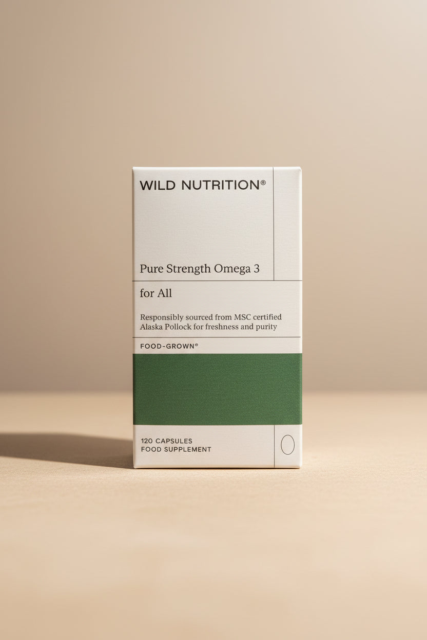 Box of Wild Nutrition Pure Strength Omega 3 supplement on a wooden surface