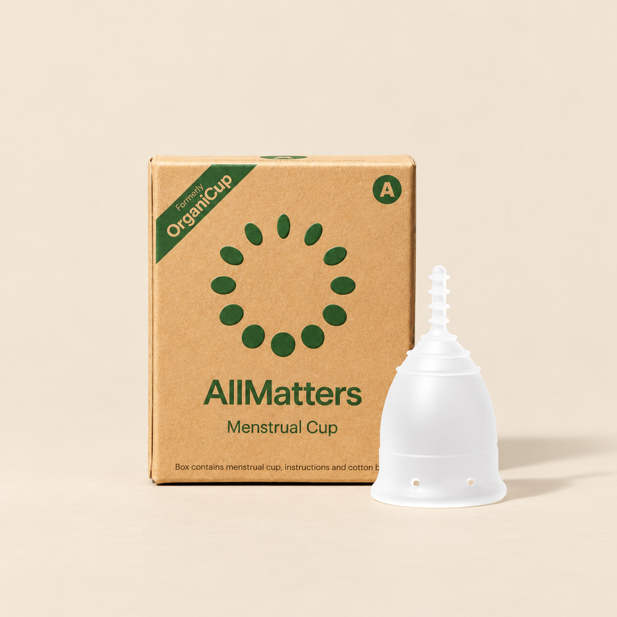 AllMatters OrganiCup Reusable Menstrual Cup – Size A on a warm beige background