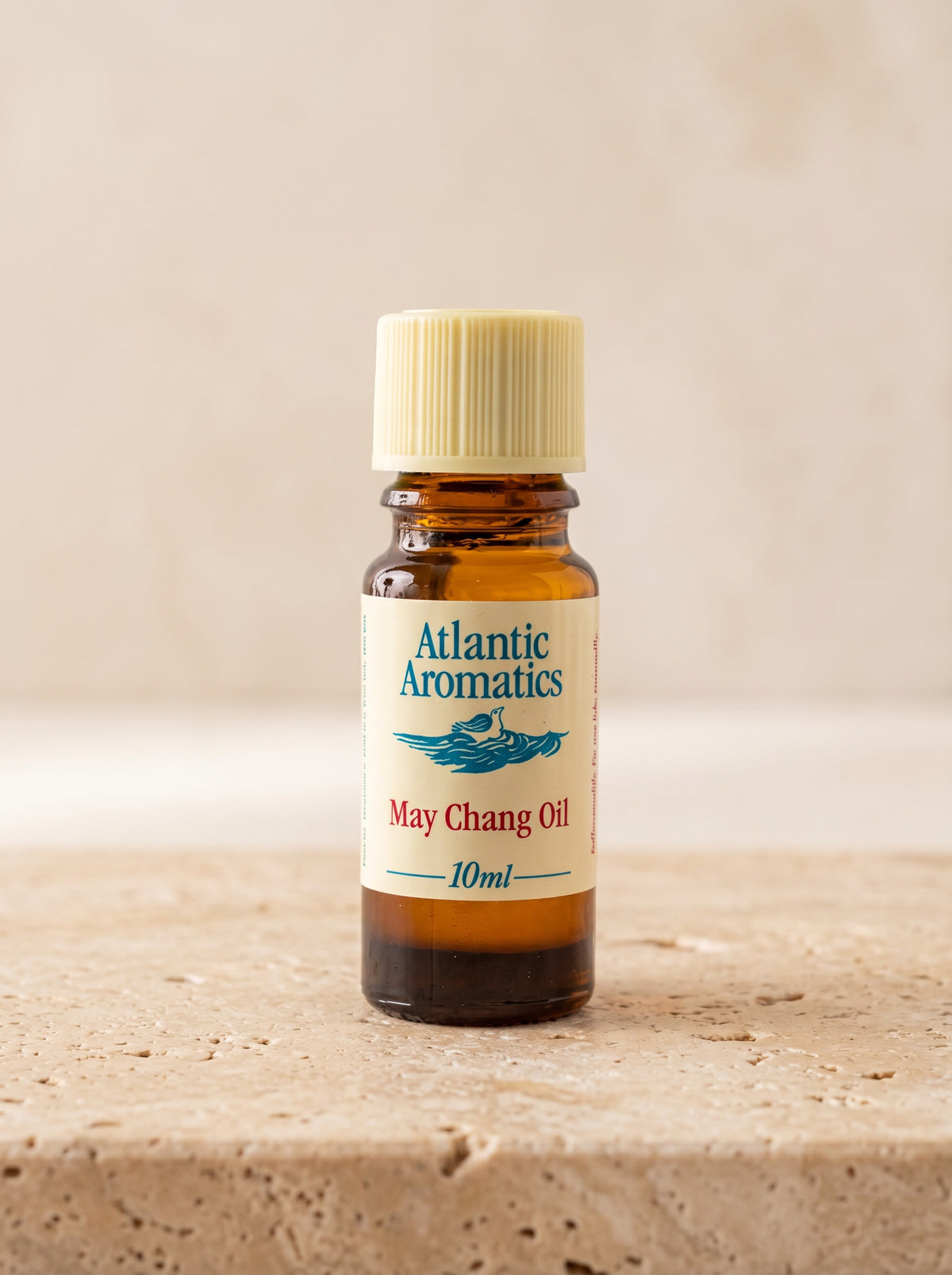 Atlantic Aromatics May Chang Essential Oil – 10ml front bottle on warm beige background