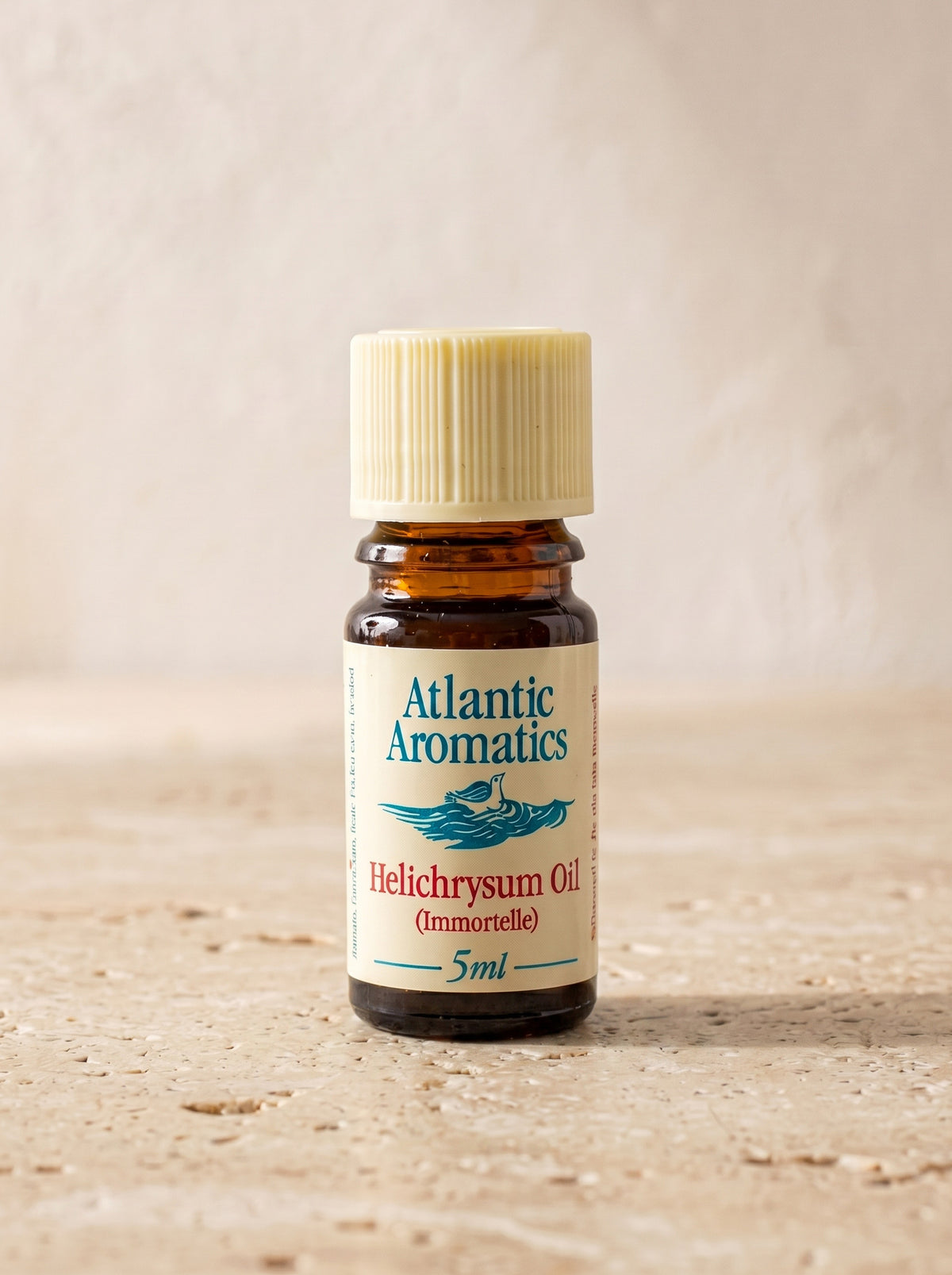 Atlantic Aromatics Organic Helichrysum (Immortelle) Essential Oil – 5ml front bottle on warm beige background