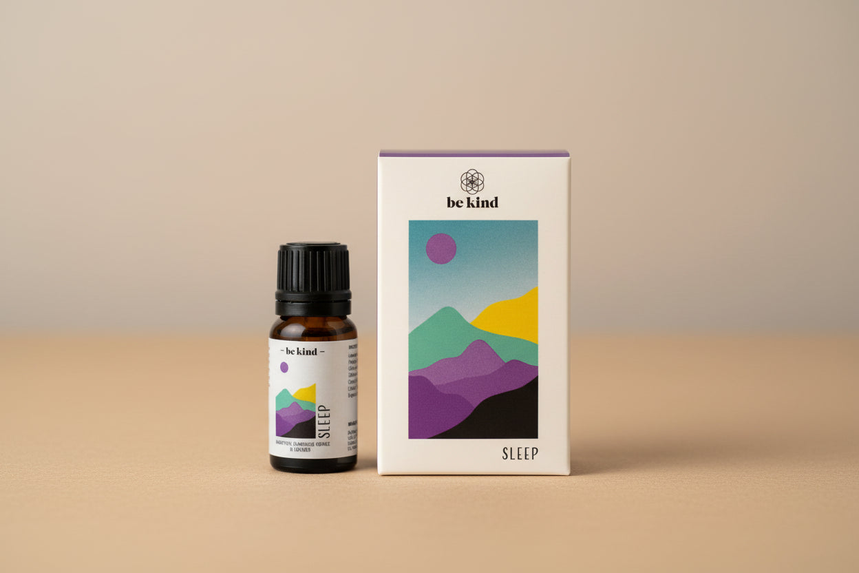 Small bottle labeled 'Sleep' with a box featuring mountain designs and 'be kind' branding on a white background.