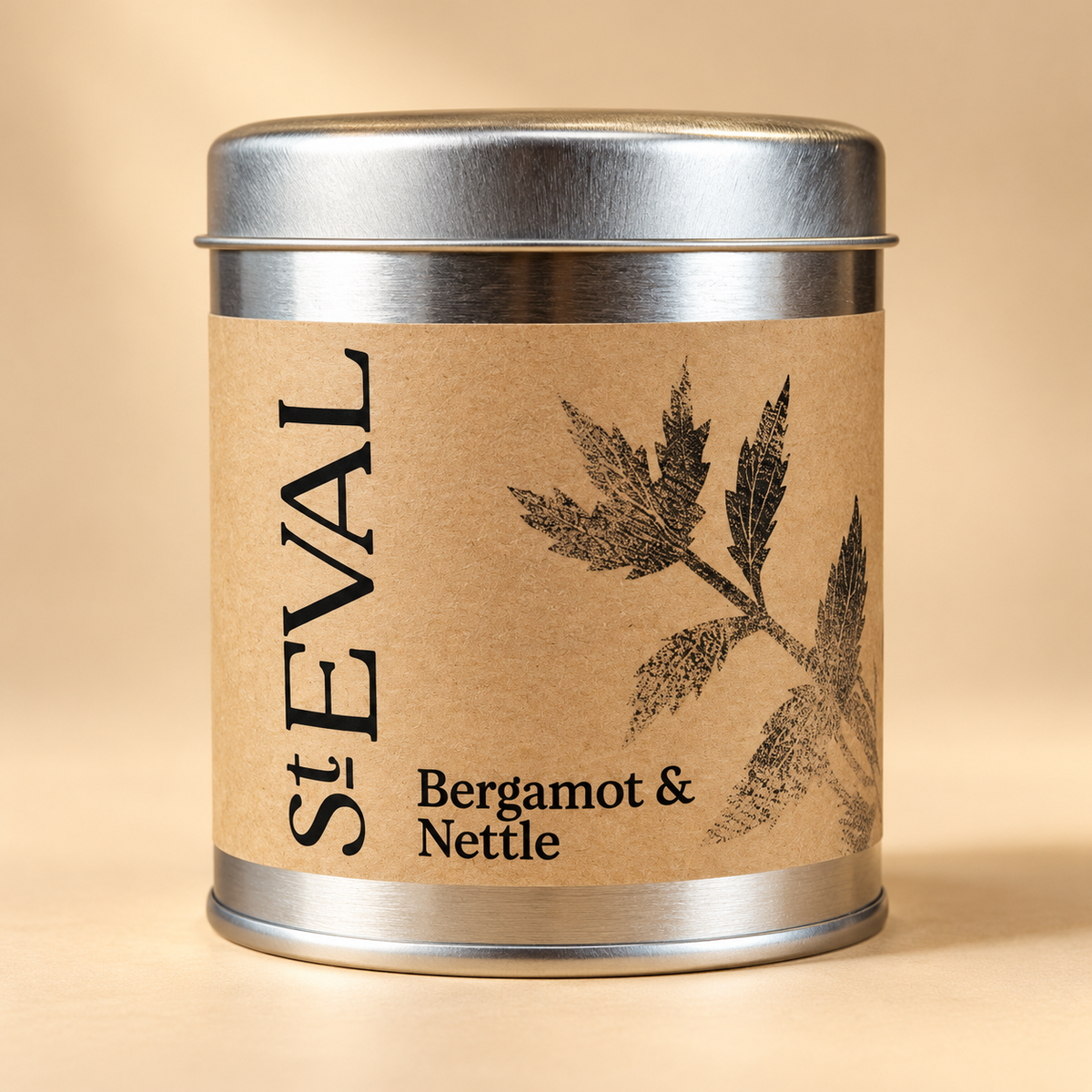 St. Eval Candle Co. Bergamot & Nettle Tin Candle — current pack on a warm cream background
