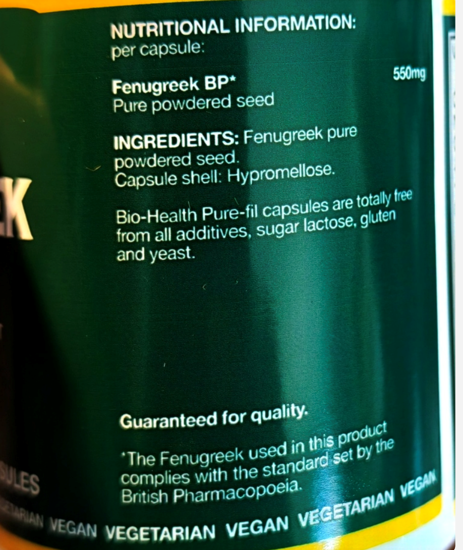 Close-up of a dark green supplement bottle label showing nutritional information and ingredients for Fenugreek BP+ capsules, including text about pure powdered seed and hyalomelose capsule shell.