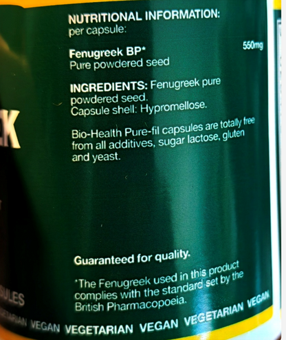 Close-up of a dark green supplement bottle label showing nutritional information and ingredients for Fenugreek BP+ capsules, including text about pure powdered seed and hyalomelose capsule shell.