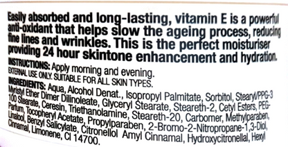Close-up of a product label showing text about vitamin E benefits and ingredients on a white background.