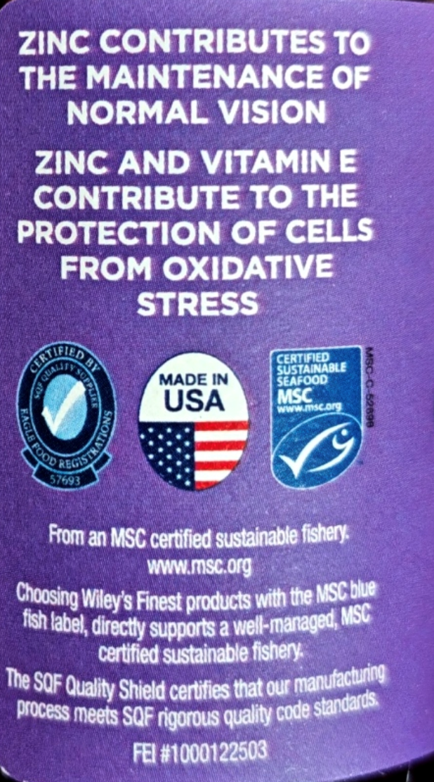 A close-up of a purple product label with white text about zinc and vitamin E for eye health, plus MSC certification logos and a 'Made in USA' emblem.