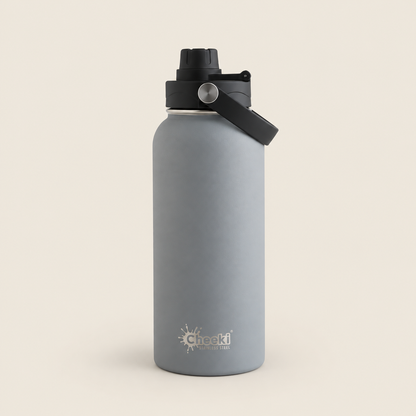 Cheeki Adventure Insulated Water Bottle – Slate 1L on a warm beige background
