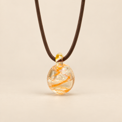 Australian Bush Flower confid pendant on a warm beige background