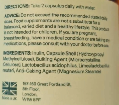 Close-up of a supplement package label showing directions, advice, ingredients, and a Made in UK mark on a beige background.