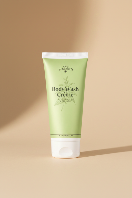 A light green squeeze tube of Double Line Herbalists Body Wash Creme with a white cap, shown on a clean white background with a soft shadow.