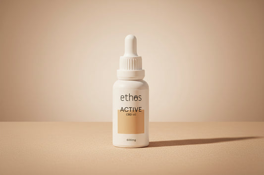 Gold necklace with a heart-shaped pendant on a white background