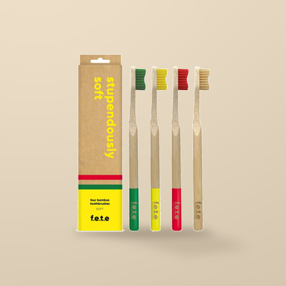 FETE Stupendously Soft Bamboo Toothbrushes – 4 Pack — original product packaging on warm beige background