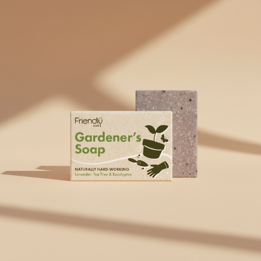 Friendly Soap Gardener's Soap bar with its kraft paper packaging box, featuring green text and gardening illustrations on a white background.