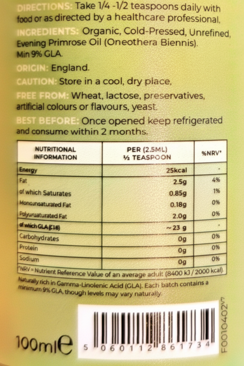 Close-up of the back of a green olive oil bottle showing the ingredients list, nutritional information table, directions, barcode, and a small amount of white text at the bottom.