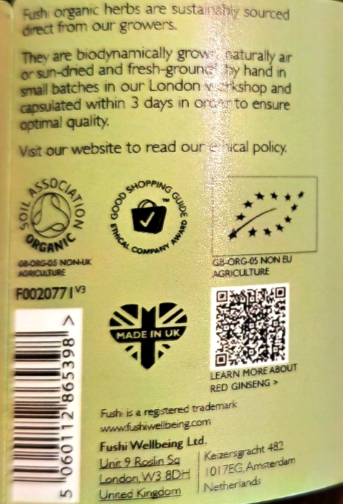 Back of a red ginseng product package showing text about sourcing, production, certifications, a barcode, and a QR code on a pale green background.