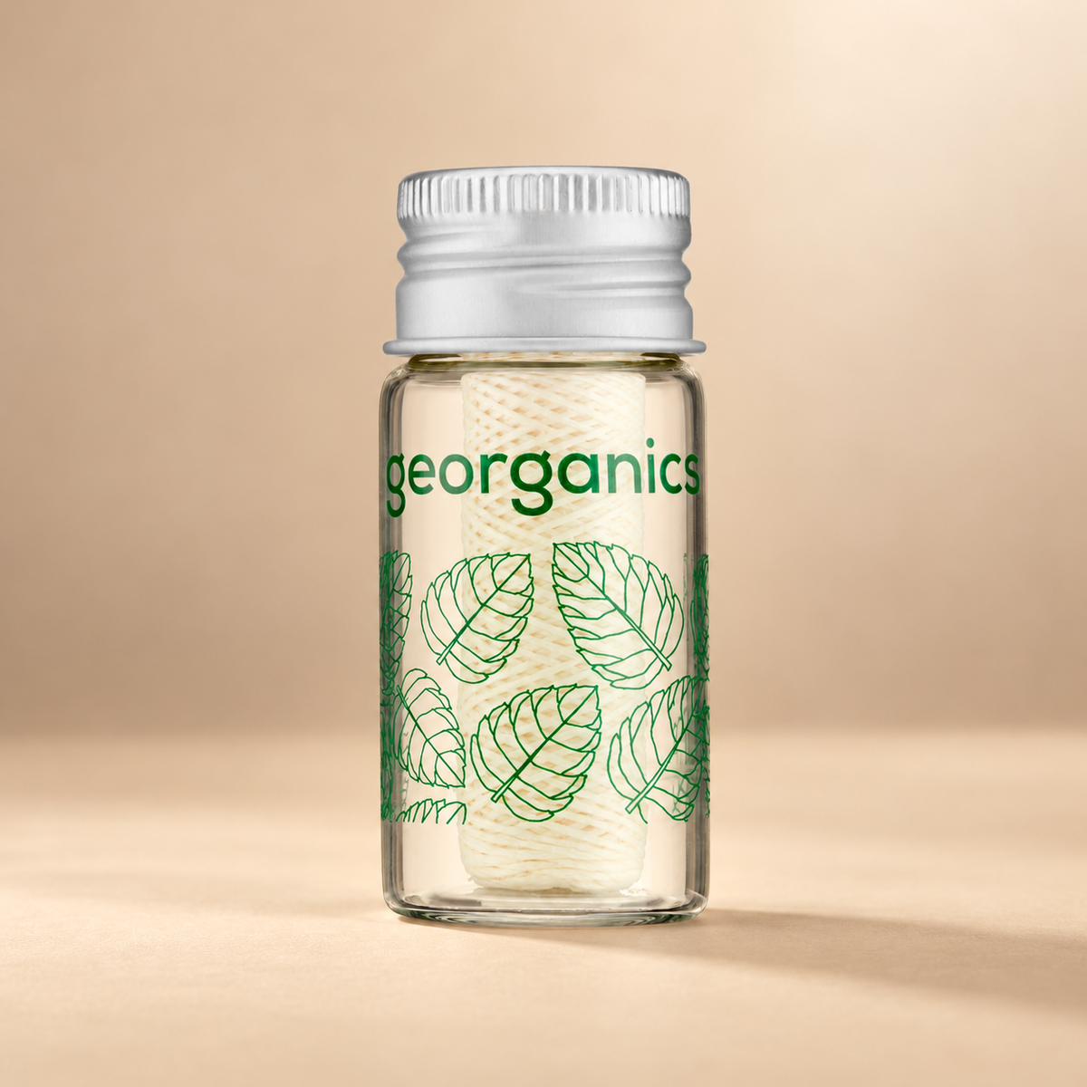 Georganics Spearmint Bionylon Dental Floss – 50m shown on the approved warm beige background