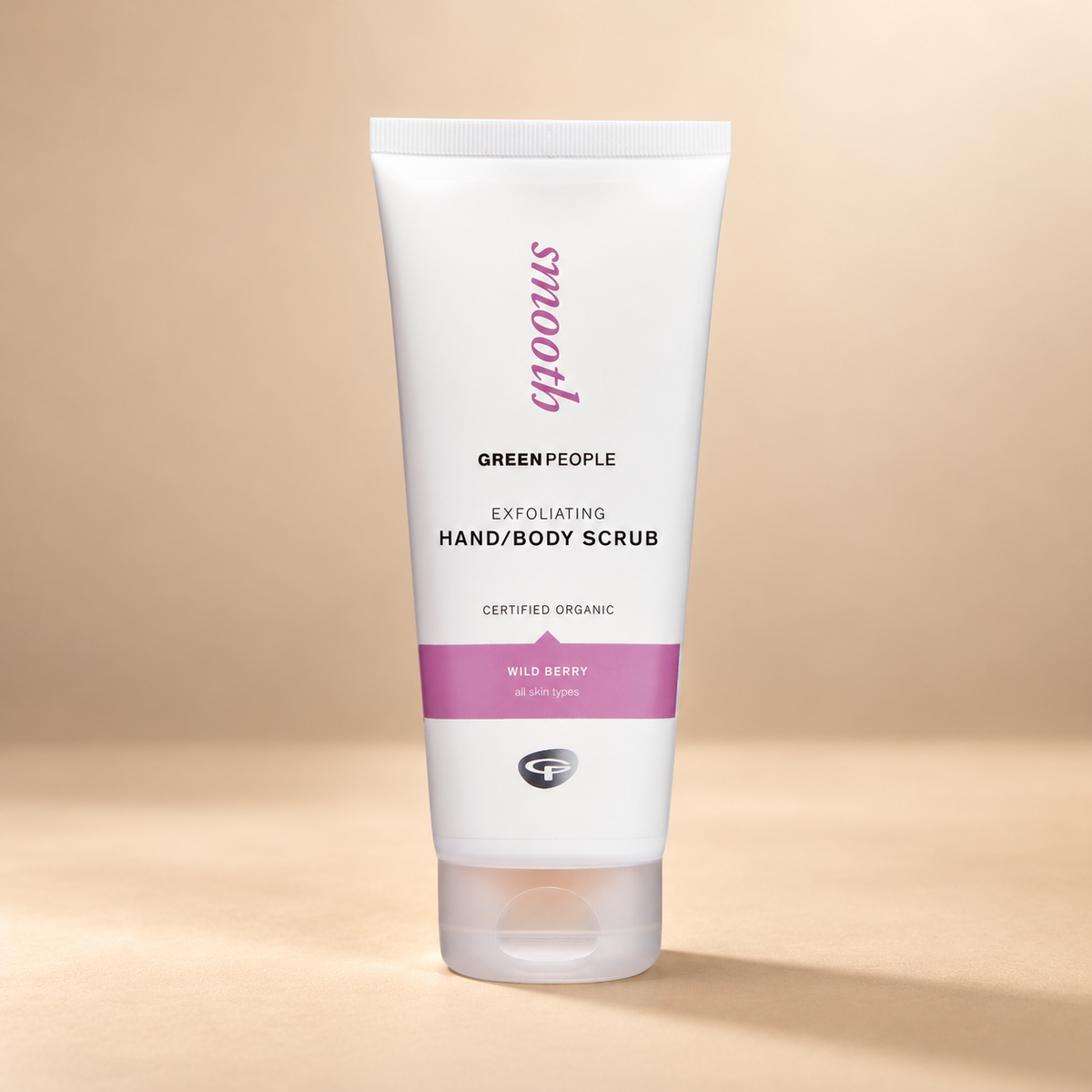 Green People Exfoliating Hand & Body Scrub – Wild Berry, 200ml in its original packaging on a warm beige background