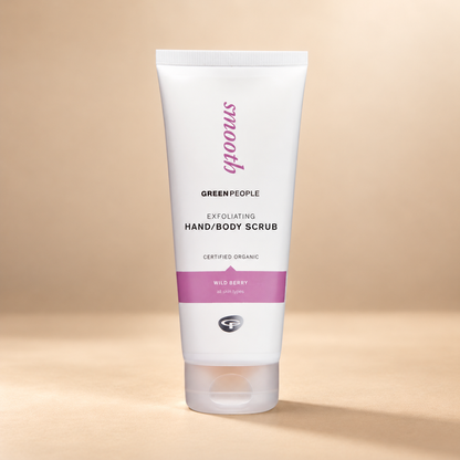 Green People Exfoliating Hand & Body Scrub – Wild Berry, 200ml in its original packaging on a warm beige background