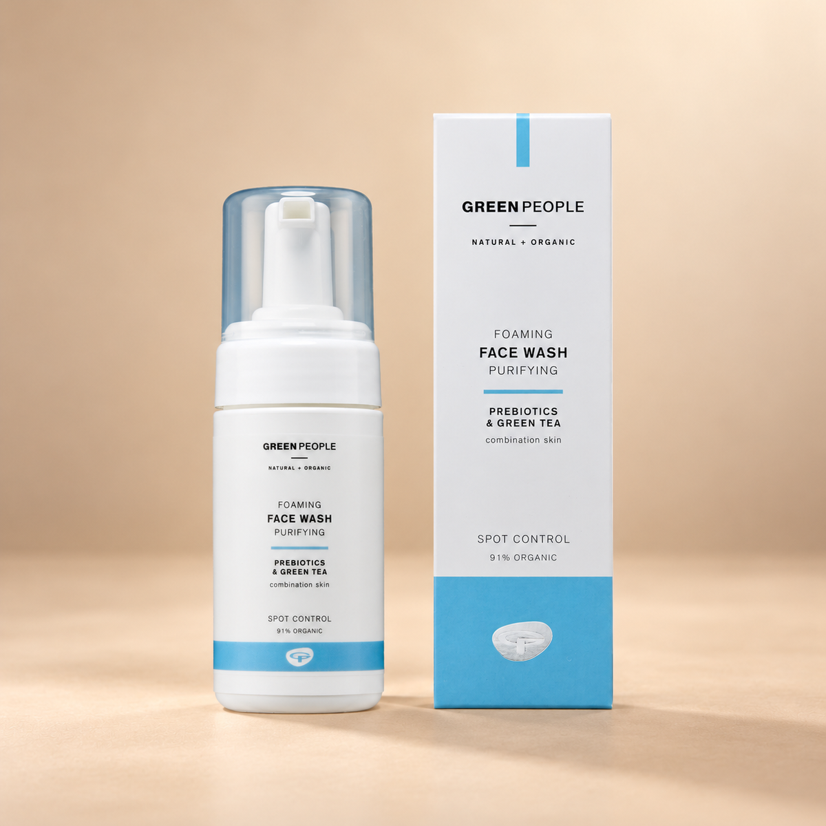 Green People Foaming Face Wash – Prebiotics & Green Tea, 100ml in its original packaging on a warm beige background
