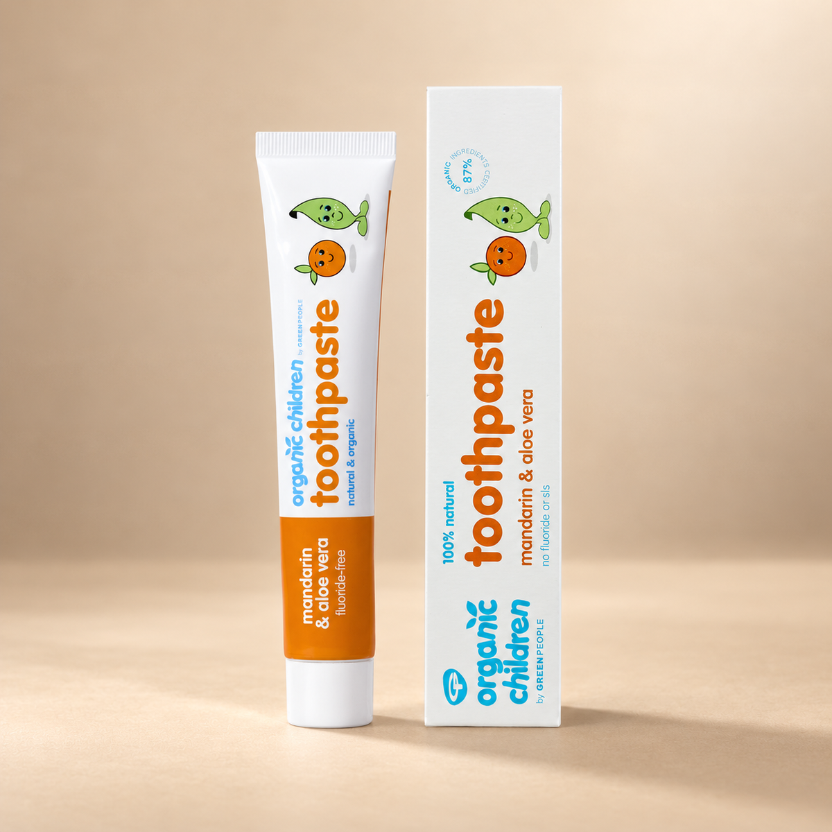 Green People Organic Children Mandarin & Aloe Vera Toothpaste – Fluoride-Free, 50ml in its original packaging on a warm beige background