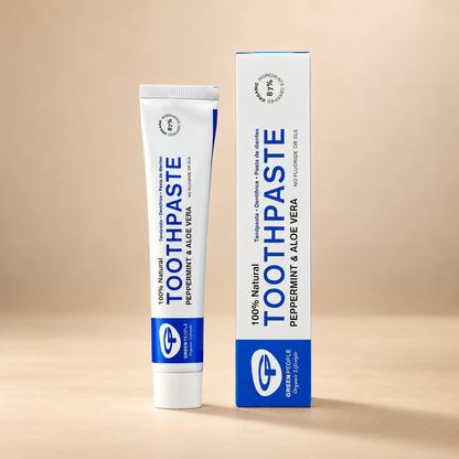 Green People Peppermint & Aloe Vera Toothpaste – Fluoride-Free, 50ml in its original packaging on a warm beige background