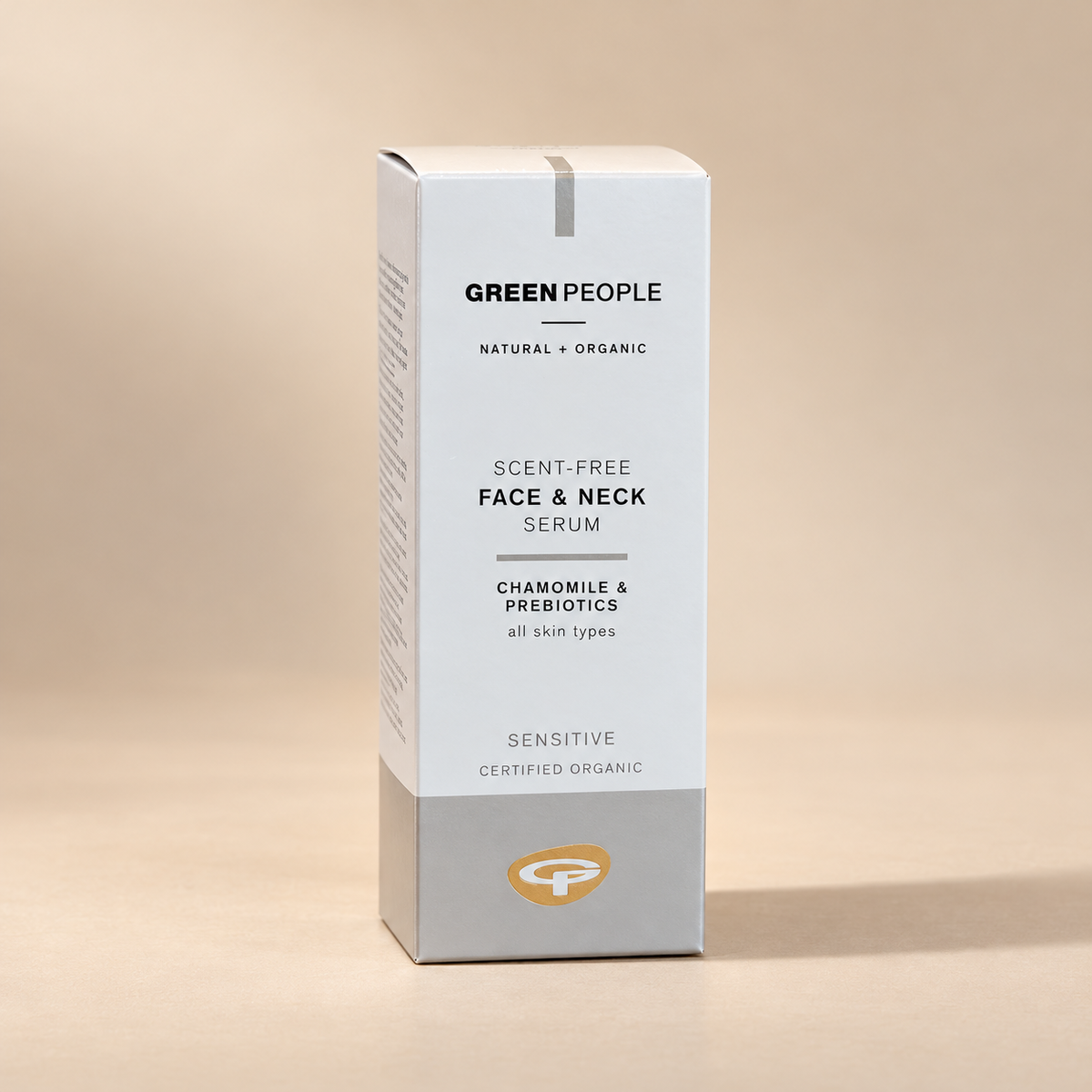 Green People Scent-Free Face and Neck Serum Chamomile and Prebiotics 50ml original carton on a warm beige background