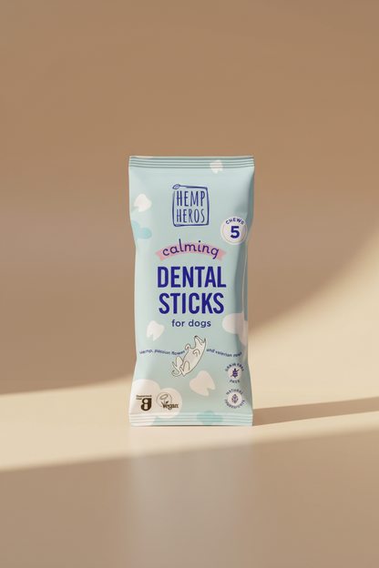 A package of Hemp Heros Calming Dental Sticks for dogs, featuring a light blue bag with white clouds and purple text.