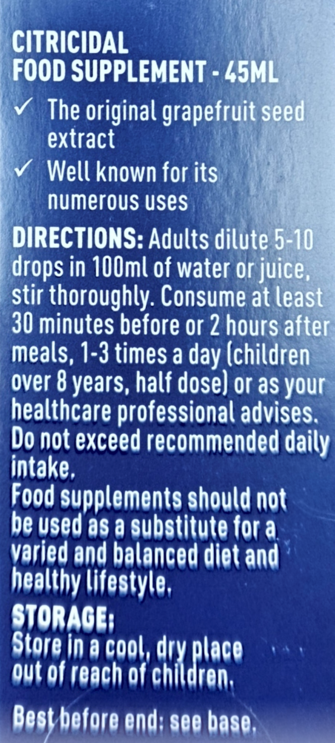 Close-up of a blue supplement bottle label with white text.