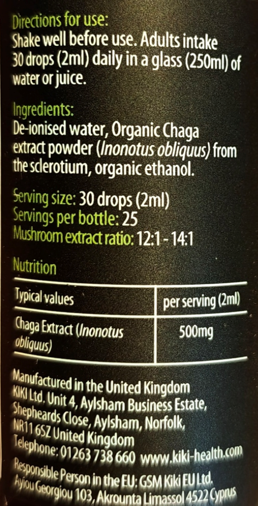 A close-up of a black product label showing white text with directions for use, ingredients, and nutrition information for Organic Chaga Extract powder.