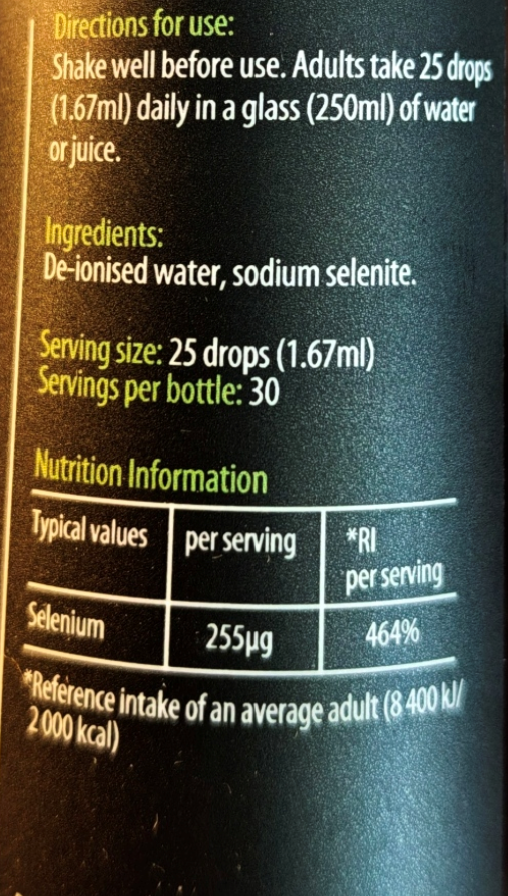 Close-up of a dark bottle label showing usage directions, ingredients, serving size, and nutrition information for selenium.