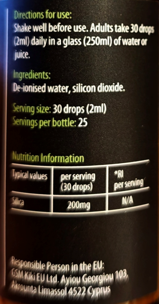 Close-up of a black bottle label showing usage directions, ingredients, serving size of 30 drops, and nutrition information for silica.